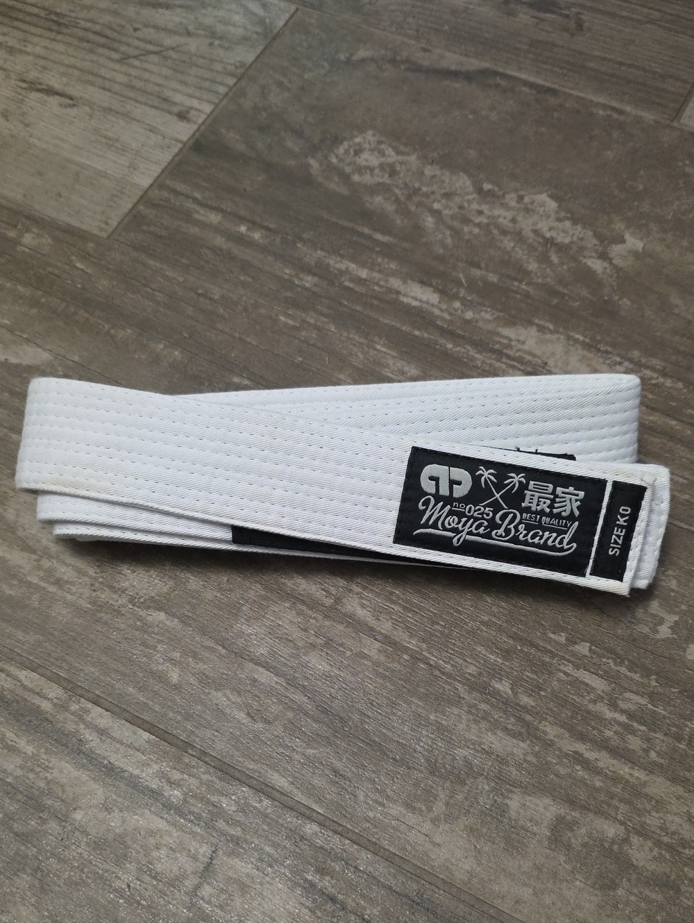 White Martial Arts Belt with 'Moya Brand' Label
